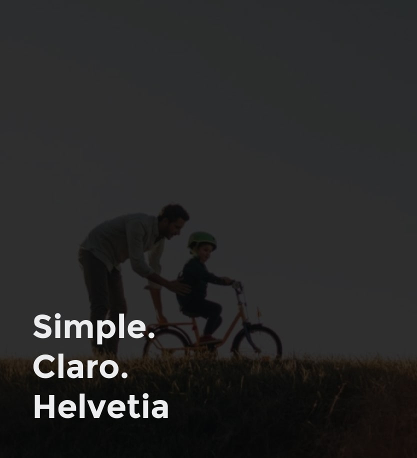 Imagen de un papa ayudando a montar en bici a su hijo